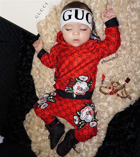 newborn baby wearing gucci.